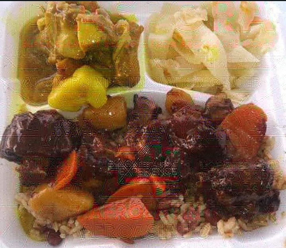 Brown stew plate over rice and peas